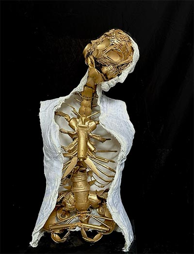 A sculpture in the form of an upper human torso.