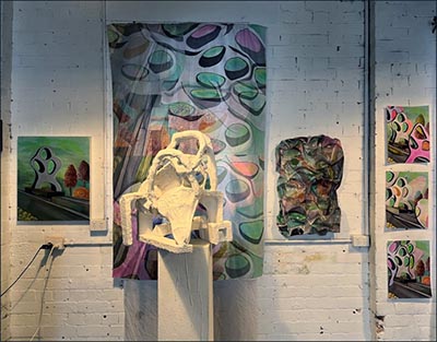 An abstract form represented in a collection of 2D and 3D mixed media.