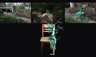 An installation featuring a chair with half of it covered in a green material shaped like vines, displayed in front of three photographs of the same chair placed in an outdoor environment, captured from different angles.