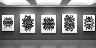 A black and white image showcasing a series of 5 digital artworks displayed on 5 canvases arranged horizontally on a wall.