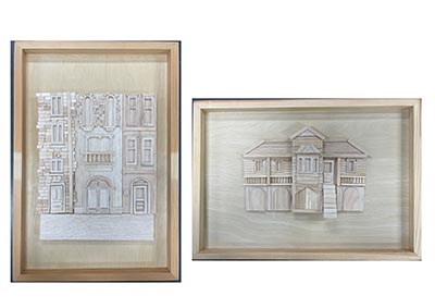 Two framed artworks, each showcasing a 3D model of a European-style house and an Australian-style house.